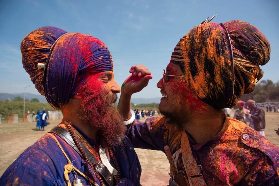 Two Nihang Sikhs playing Holi at Hola Mohalla